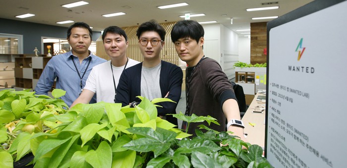 The employees of Wanted pose for a photo. Wanted is a social network-based recruitment firm.