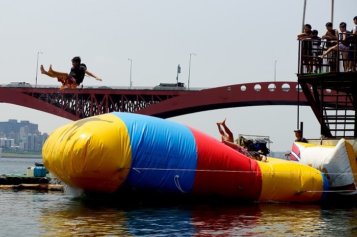 The 'blob jump' works when one person jumps on one end of the blob and the other person is at the other end, being launched into the air and falling into the water.