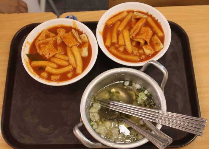 The streets of Bukchon are lined with beautiful and cozy cafés and restaurants, as well as street stalls selling popular snacks like <i>tteokbokki</i>, ice cream, waffles and whatever else the chefs can think of.