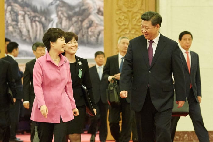 President Park Geun-hye and Chinese President Xi Jinping walk toward the venue of the special luncheon after holding the Korea-China summit in Beijing on Sept 2.