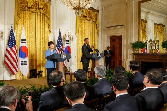 U.S. President Barack Obama answers questions during a joint press conference with President Park Geun-hye (left) at the White House on Oct. 17.