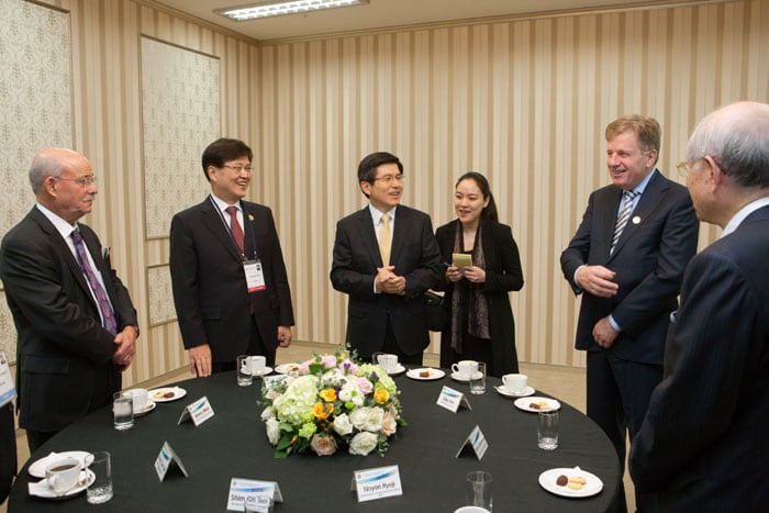 Participants in the World Science & Technology Forum chat during the opening ceremony.