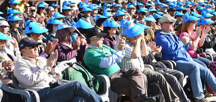 Crowds watch a forest fire joint fire fighting drill.