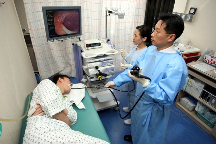 A patient receives an endoscopic stomach examination at the National Cancer Center. The government has expanded medical healthcare coverage in 2016.