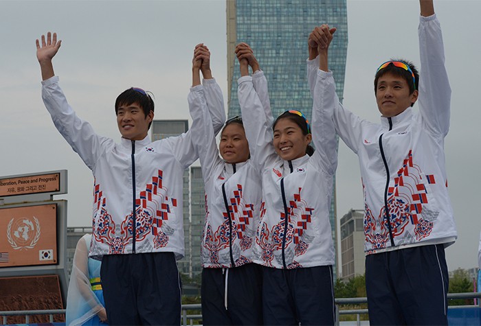 (From left) Kim Ji-Hwan, Kim Gyu-ri, Jyeong Hye-rim and Heo Min-ho cheer as they win the silver medal in the triathlon mixed relay competition at the 2014 Incheon Asian Games. 