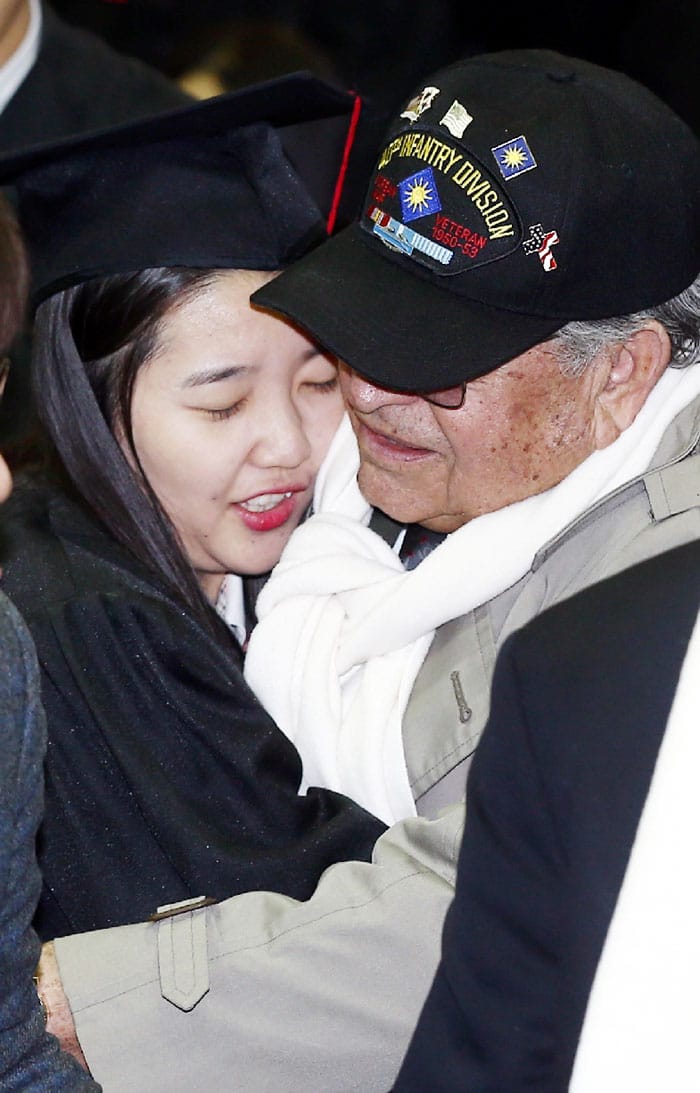 A U.S. veteran from the 40th Infantry Division embraces a student during a graduation ceremony at the Gwanin Middle and High Schools on Feb. 3 in Pocheon, Gyeonggi-do Province.