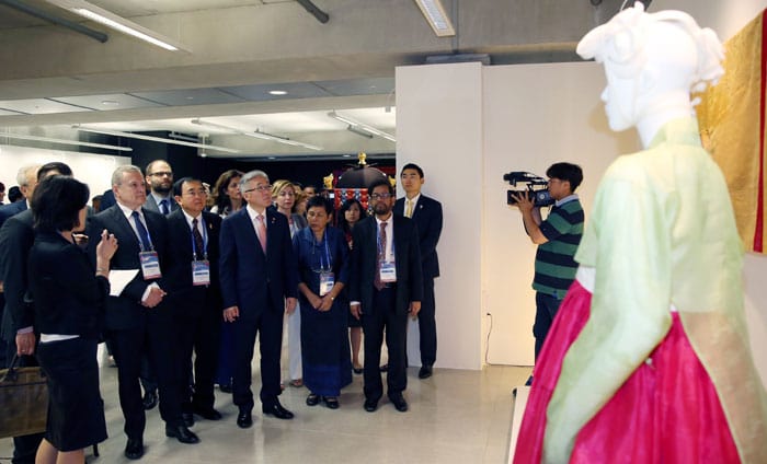After the opening ceremony, representatives of some of the 44 ASEM governments attending the seventh Asia-Europe Culture Ministers' Meeting look at some of the exhibits on display at the Asia Culture Center. 