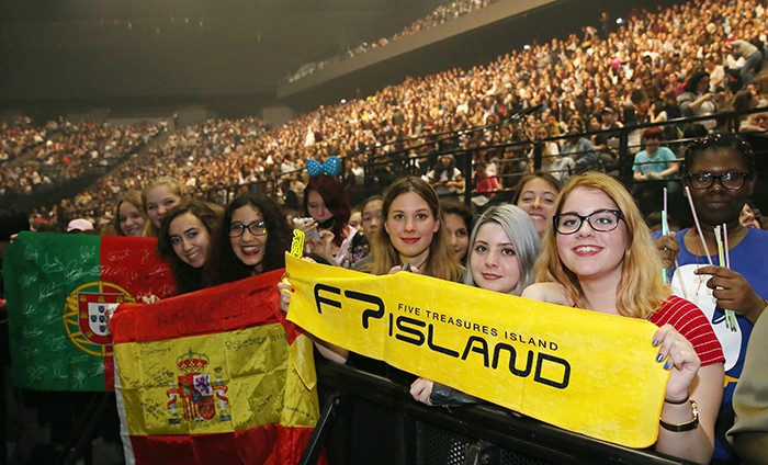 Their passion for K-pop spans equally across Africa and Europe. Fans on both continents reveal their love and passion for their favorite K-pop stars, holding up their own handmade messages and placards. The top photo shows fans attending the K-culture in Kenya concert, and the bottom photo shows K-pop fans from across Europe who descended on Paris for the KCON France 2016 festival. 