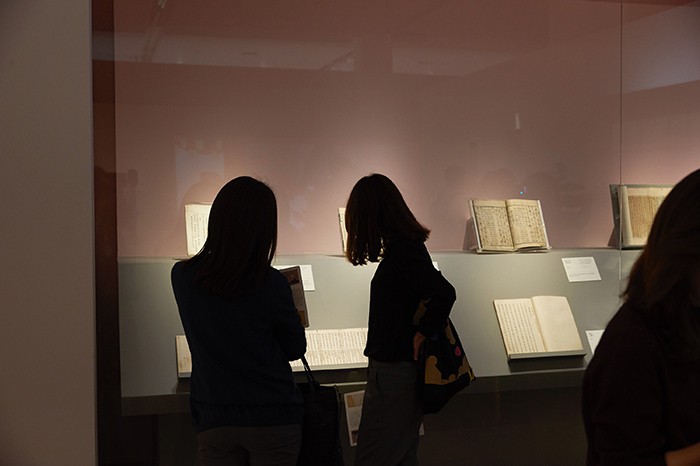 Visitors look at some of the books transcribed by Princess Deogon. The princess loved reading and transcribing them so much that she brought more than 4,000 books to her home in Jeodong after the wedding.