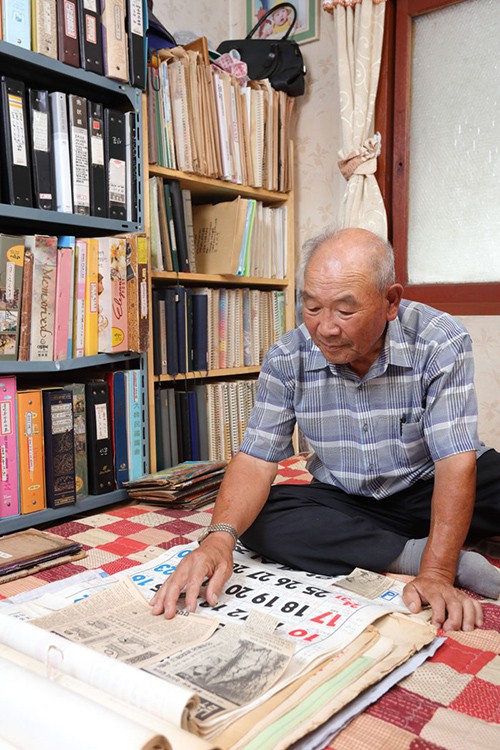 Farmer Yim Dae-gyu looks at his collection of records and old calendars. Yim has been keeping detailed records of his daily routine and a farming journal in notebooks and calendars for 59 years.