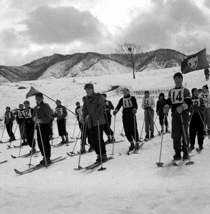In 1954, skiers gather ahead of a race in the National Winter Sports Festival. Though they didn't wear safety equipment common to today, such as helmets or goggles, they were as serious as athletes who participate in the Winter Olympics.