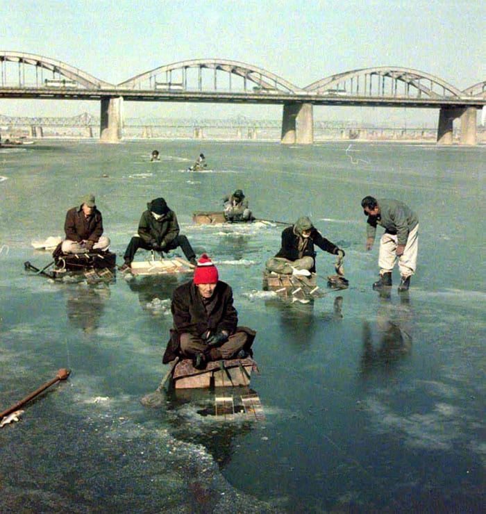 In 1976, anglers enjoy some ice fishing on the Hangang River, despite the cold.