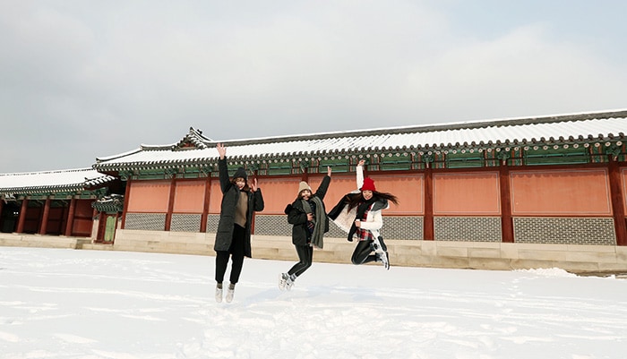 Visitors to Changdeokgung Palace enjoy the snow and snap a few photos on Dec. 20.