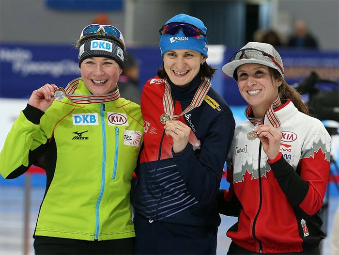 Martina Sablikova (center) of Czechia celebrates on the podium after winning the women’s 5,000 m race at the ISU World Single Distances Speed Skating Championships at the Gangneung Oval in Gangneung, Gangwon-do Province, on Feb. 11. Sablikova won ahead of second place Claudia Pechstein (left) of Germany and third place Ivanie Blondin (right) of Canada.