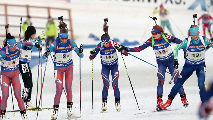 Ekaterina Avvakumova (third from the right) of the Korean team begins the race, as her previous team mate, Anna Frolina, touches her arm, during the women’s relay in the IBU Biathlon World Cup, at the Alpensia Biathlon Center in Pyeongchang, Gangwon-do Province, on March 5.