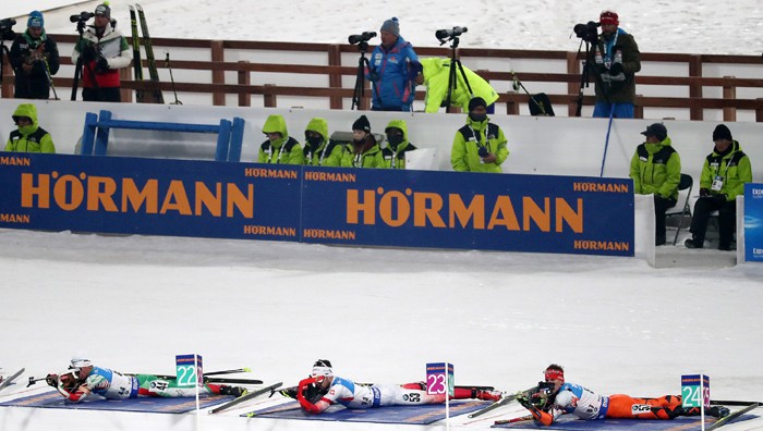 Athletes lie prone at the shooting range during the men’s 12.5 km pursuit event at the IBU Biathlon World Cup, at the Alpensia Biathlon Center in Pyeongchang, Gangwon-do Province, on March 4.