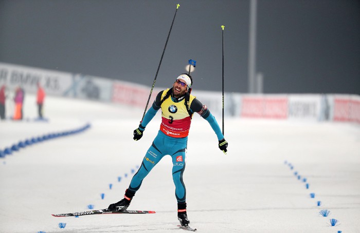 Martin Fourcade of France passes the finish line with joy as he wins the men’s 12.5 km pursuit event in the IBU Biathlon World Cup at the Alpensia Biathlon Center in Pyeongchang, Gangwon-do Province, on March 4.