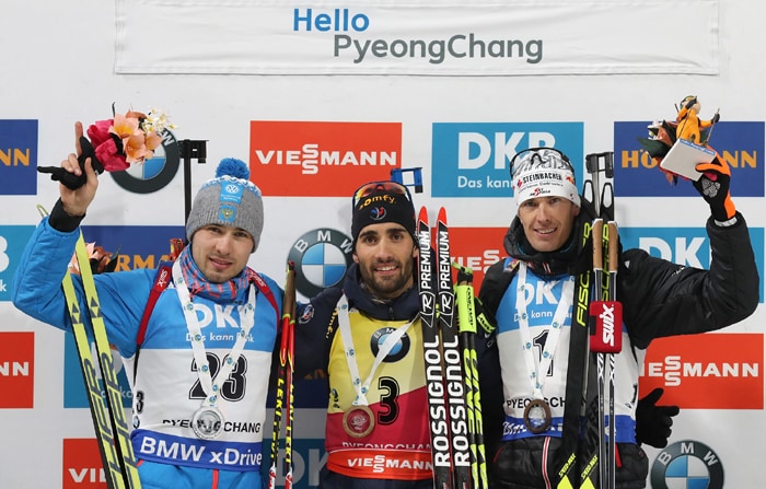 Martin Fourcade of France (center) poses for a photo with the gold medal, along with Russia’s Anton Shipulin (left) and Julian Eberhard of Austria who took the silver and bronze in the men’s 12.5 km pursuit event in the IBU Biathlon World Cup at the Alpensia Biathlon Center in Pyeongchang, Gangwon-do Province, on March 4.