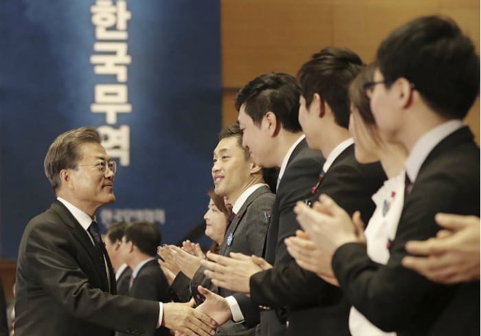 President Moon Jae-in greets award winners during a ceremony to mark the nation's 54th Trade Day, at the COEX convention center in Samseong-dong, Gangnam-gu District, Seoul, on Dec. 5.