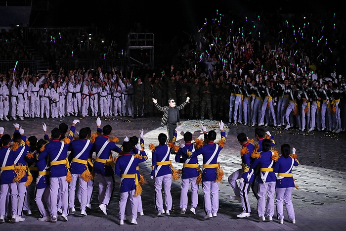 Psy performs during the 70th anniversary of Armed Forces Day at the Peace Plaza of the War Memorial of Korea in Yongsan-gu District, Seoul on Oct. 1.